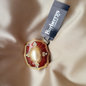 BURBERRYS RED PEARL BROOCHE